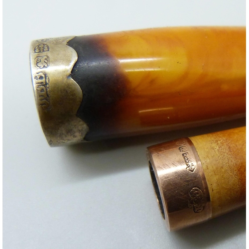 7053 - A 9ct gold mounted cigarette holder, London 1901 and a similar butterscotch amber example with silve... 