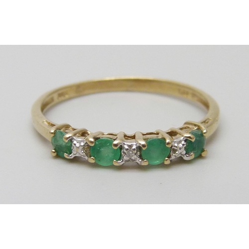 7055 - A 9ct gold, emerald and diamond ring, 1.3g, P