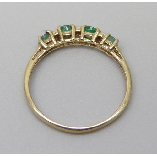 7055 - A 9ct gold, emerald and diamond ring, 1.3g, P