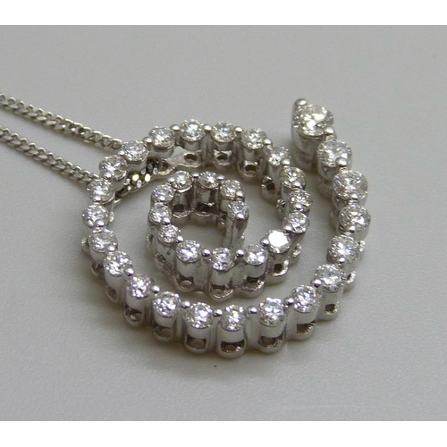 7058 - An 18ct white gold and diamond pendant and 18ct white gold chain, 4.8g, chain 43cm