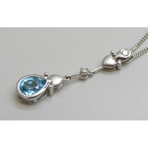 7066 - An 18ct white gold, topaz and diamond pendant and 18ct white gold chain, 4.9g, chain 45cm