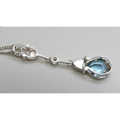 7066 - An 18ct white gold, topaz and diamond pendant and 18ct white gold chain, 4.9g, chain 45cm