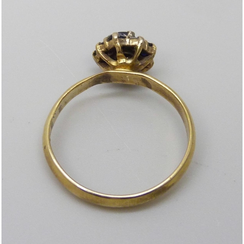 7079 - A yellow metal sapphire and diamond ring, 2.4g, N