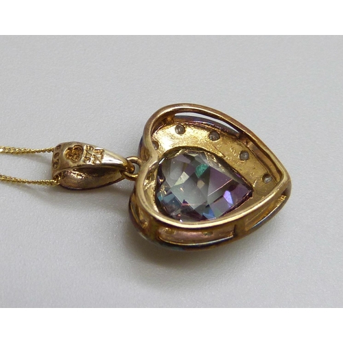 7085 - A 9ct gold, mystic topaz and diamond pendant and chain, 2g, chain 44cm