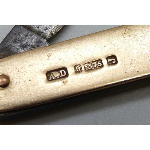 7090 - A 9ct gold mounted pocket knife, Birmingham 1903, 57mm without loop