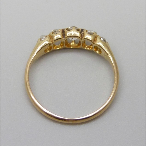 7091 - A Victorian yellow metal ring set with five old cut diamonds, 1.9g, J/K