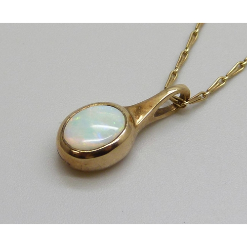 7099 - A 9ct gold and opal pendant and chain, 3.9g, chain 50cm, boxed