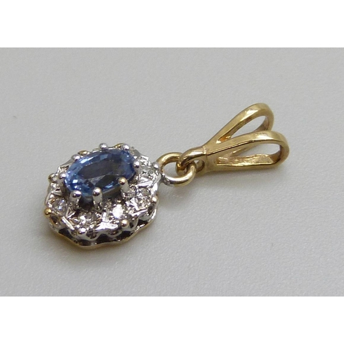 7100 - A 9ct gold, diamond and blue stone pendant, 0.9g