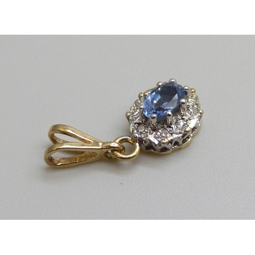 7100 - A 9ct gold, diamond and blue stone pendant, 0.9g