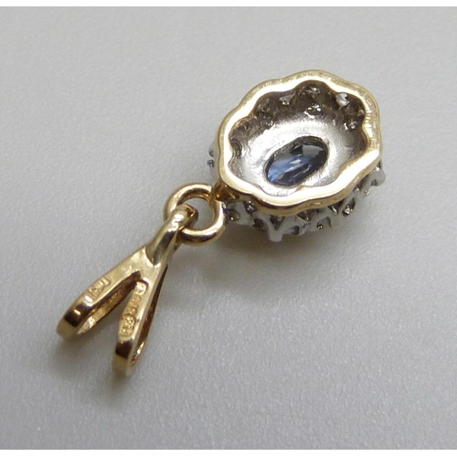 7100 - A 9ct gold, diamond and blue stone pendant, 0.9g