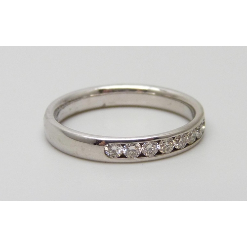 7103 - A 9ct white gold half eternity ring set with half a carat of diamonds, 2.4g, M