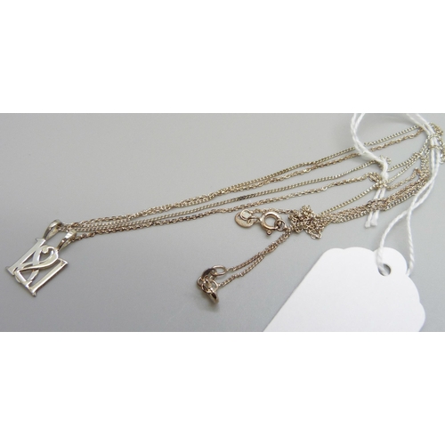 7107 - Two silver pendants on silver chains