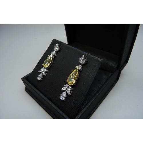 7111 - A pair of silver yellow Swarovski cubic Zirconia drop earrings by Cavendish French, 8.4g