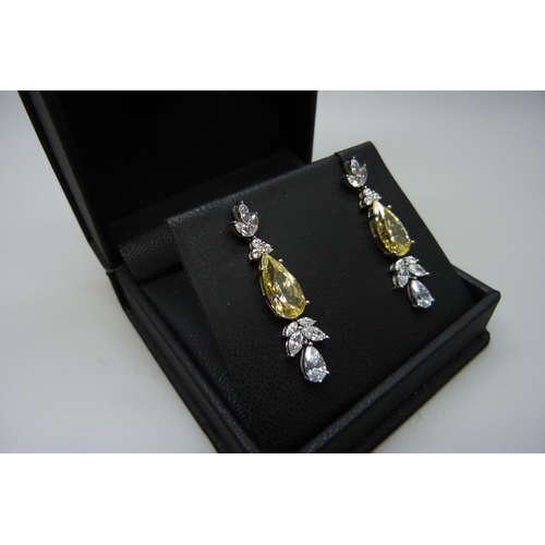 7111 - A pair of silver yellow Swarovski cubic Zirconia drop earrings by Cavendish French, 8.4g