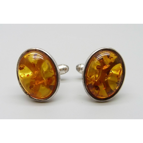 7113 - A pair of silver and oval amber cufflinks, 8.2g