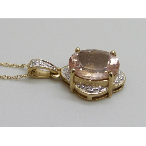 7121 - A 9ct yellow gold morganite and diamond pendant on a 9ct chain, 2.7g