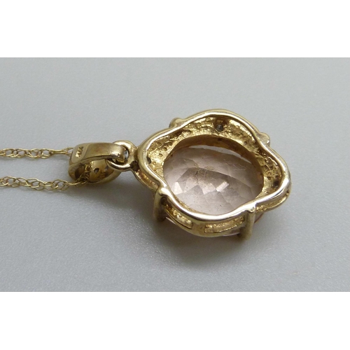 7121 - A 9ct yellow gold morganite and diamond pendant on a 9ct chain, 2.7g