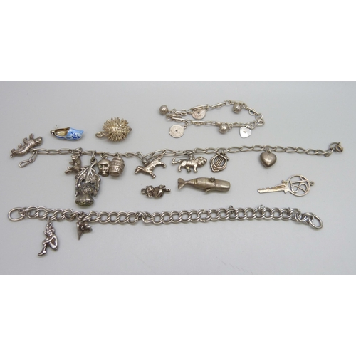 7128 - Three silver charm bracelets, together with loose charms A/F, 66.5g