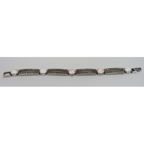 7129 - A silver, marcasite and synthetic opal bracelet, 23.1g