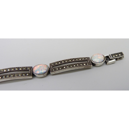 7129 - A silver, marcasite and synthetic opal bracelet, 23.1g