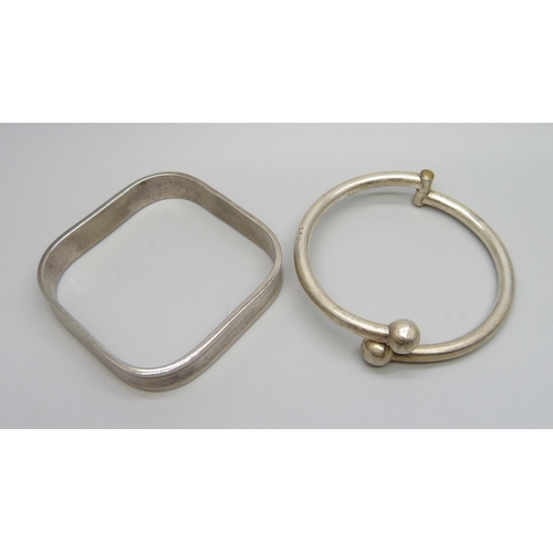 7130 - Two silver bangles, 59.2g