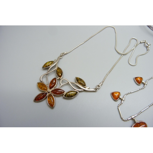 7133 - Two silver and amber necklets and a silver and amber bangle