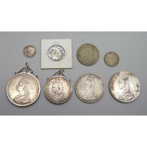 7137 - Two Victorian crowns, 1887 and 1891, one mounted, a double florin, a half-crown, two shillings, six ... 