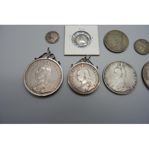 7137 - Two Victorian crowns, 1887 and 1891, one mounted, a double florin, a half-crown, two shillings, six ... 