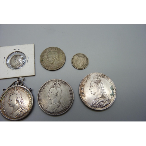 7137 - Two Victorian crowns, 1887 and 1891, one mounted, a double florin, a half-crown, two shillings, six ... 