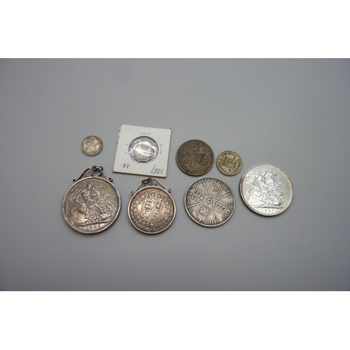 7137 - Two Victorian crowns, 1887 and 1891, one mounted, a double florin, a half-crown, two shillings, six ... 