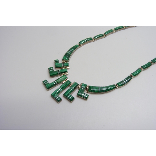 7141 - A malachite set silver ring, necklet and pendant, ring size N/O