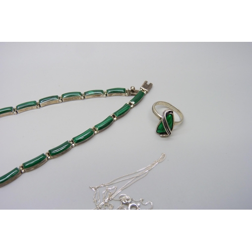 7141 - A malachite set silver ring, necklet and pendant, ring size N/O