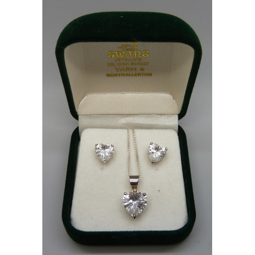 7145 - A pair of diamond simulant earrings with pendant and chain