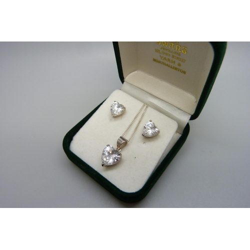 7145 - A pair of diamond simulant earrings with pendant and chain