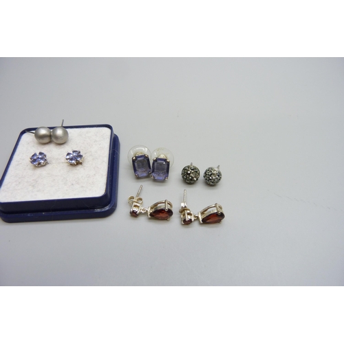 7155 - A pair of tanzanite earrings and three other pairs of gem set earrings