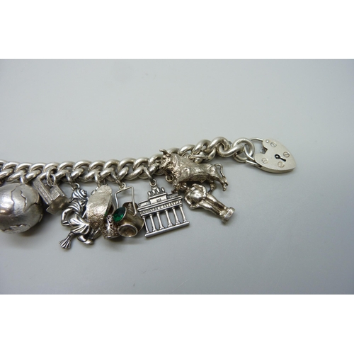 7157 - A heavy silver charm bracelet, 114g