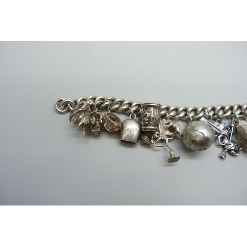 7157 - A heavy silver charm bracelet, 114g