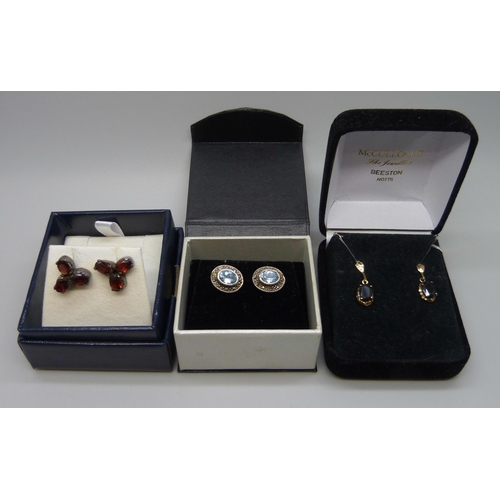 7158 - A pair of yellow metal set sapphire earrings, in original box, and two pairs of silver earrings