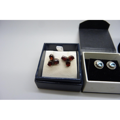 7158 - A pair of yellow metal set sapphire earrings, in original box, and two pairs of silver earrings