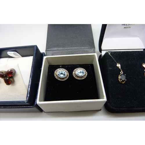 7158 - A pair of yellow metal set sapphire earrings, in original box, and two pairs of silver earrings