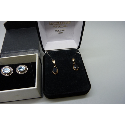 7158 - A pair of yellow metal set sapphire earrings, in original box, and two pairs of silver earrings