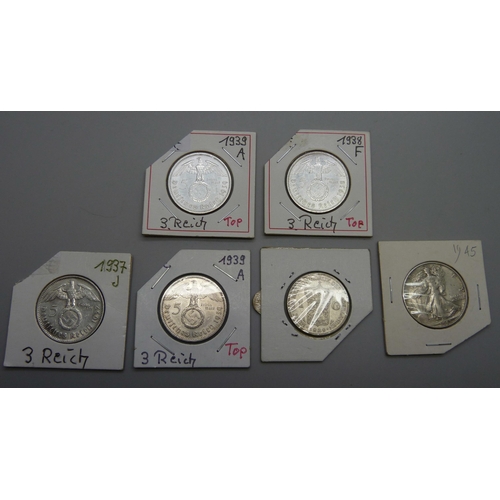 7167 - A group of six silver coins, 1929, one Gulden, 1945 ½ dollar, 1937, 1938 and two 1939 five Reichs Ma... 