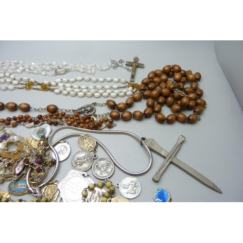 7216 - A collection of rosaries, cross pendants, etc.