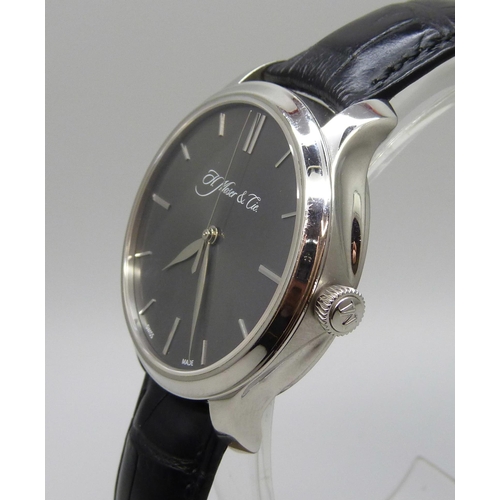 7268 - An H. Moser & Cie Monard platinum manual wind wristwatch with exhibition case back and power reserve... 