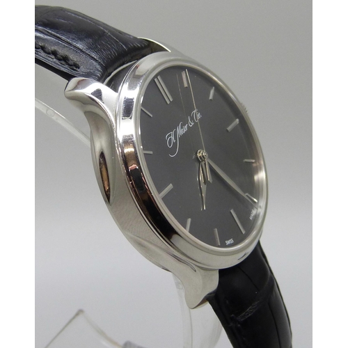 7268 - An H. Moser & Cie Monard platinum manual wind wristwatch with exhibition case back and power reserve... 