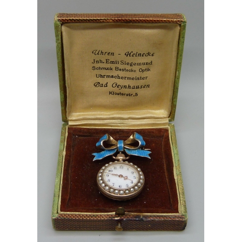 7278 - A silver gilt and split pearl pendant watch on enamelled bow clasp