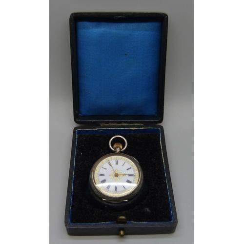 7279 - A silver open face fob watch in fitted case