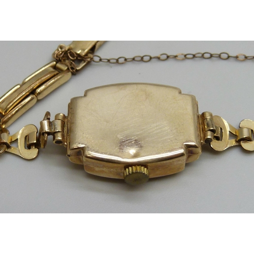 7294 - A lady's 9ct gold wristwatch on a rolled gold bracelet, together with a pair of Art Deco silver cuff... 