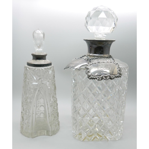 7321 - A silver mounted glass scent bottle, a silver mounted glass decanter and two silver labels, whisky a... 