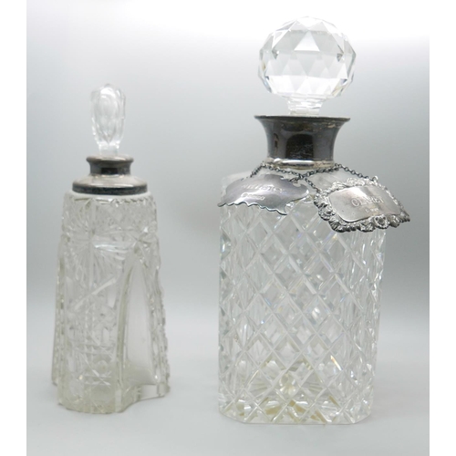 7321 - A silver mounted glass scent bottle, a silver mounted glass decanter and two silver labels, whisky a... 